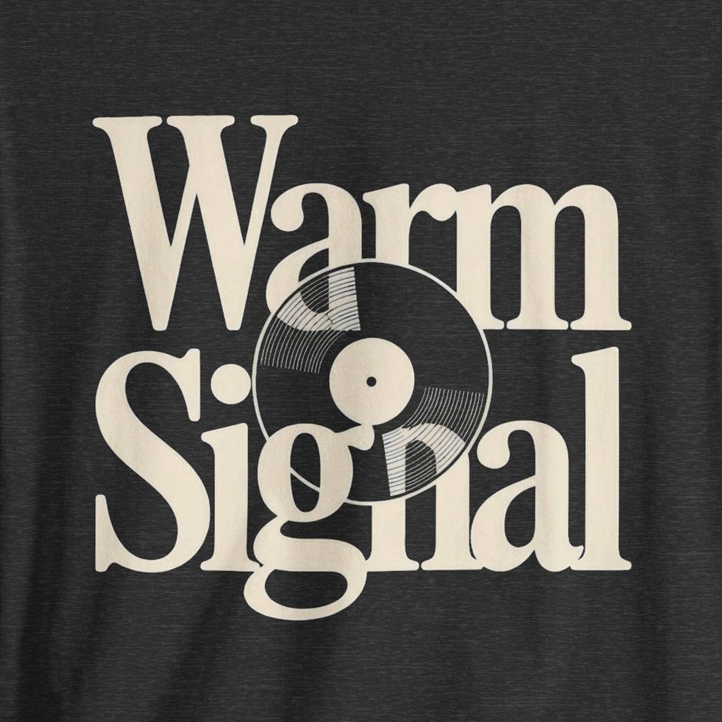 Black t-shirt with 'Warm Signal' text and vinyl record graphic on a dark background