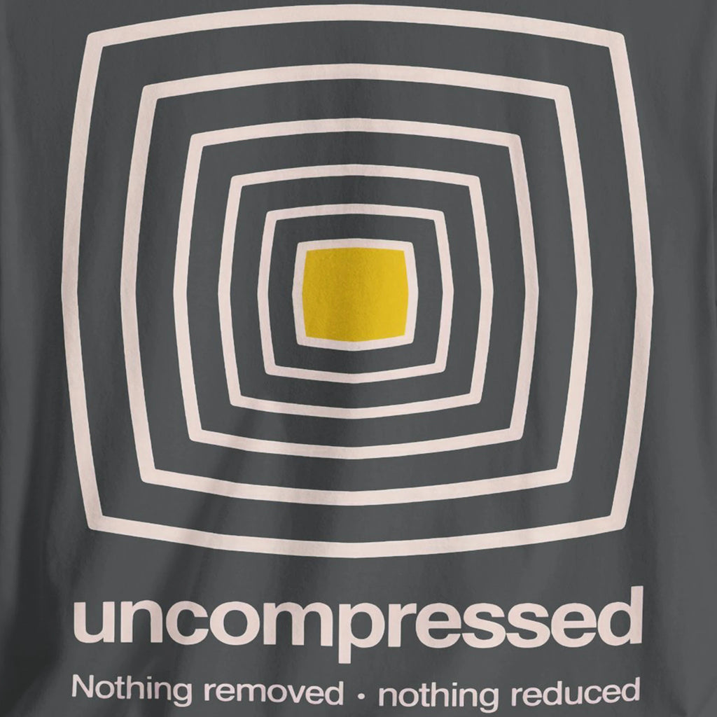T-shirt with geometric design and text 'uncompressed' on a dark gray background