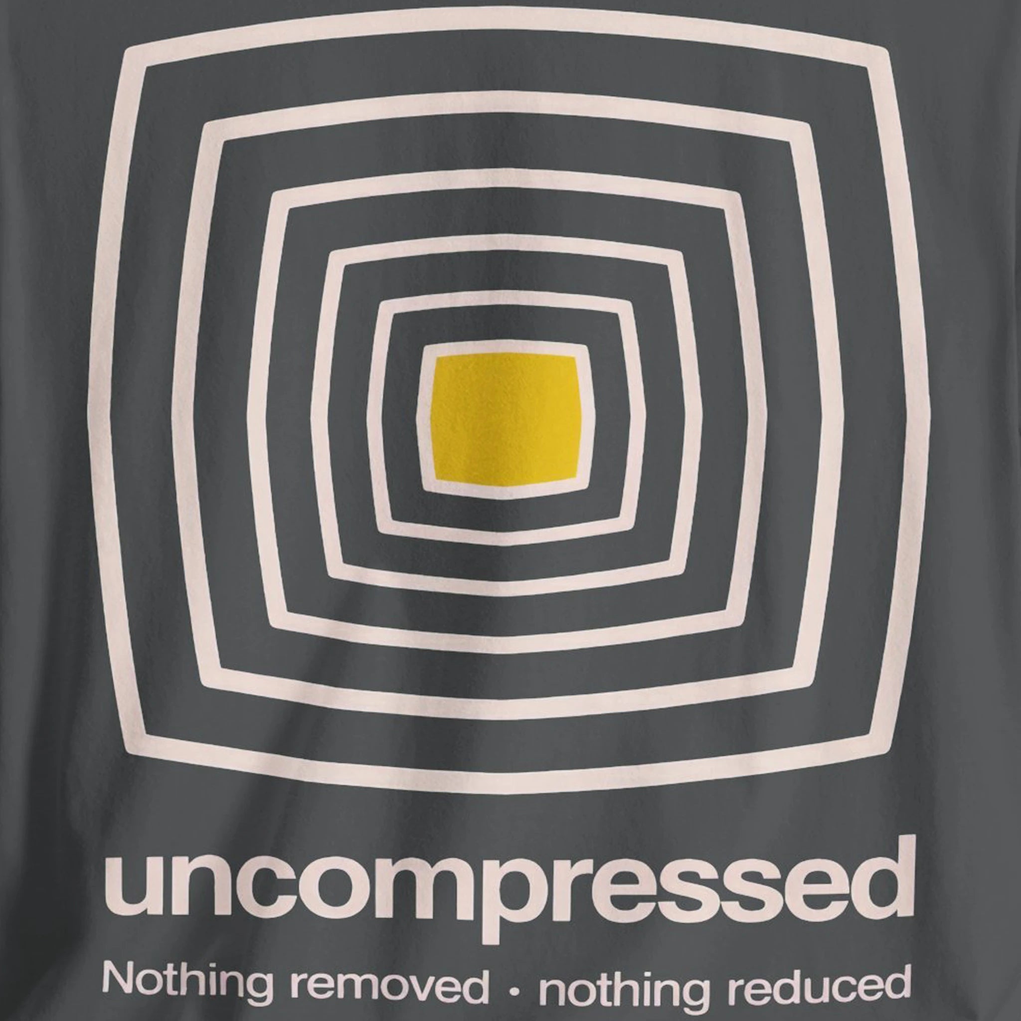 T-shirt with geometric design and text 'uncompressed' on a dark gray background