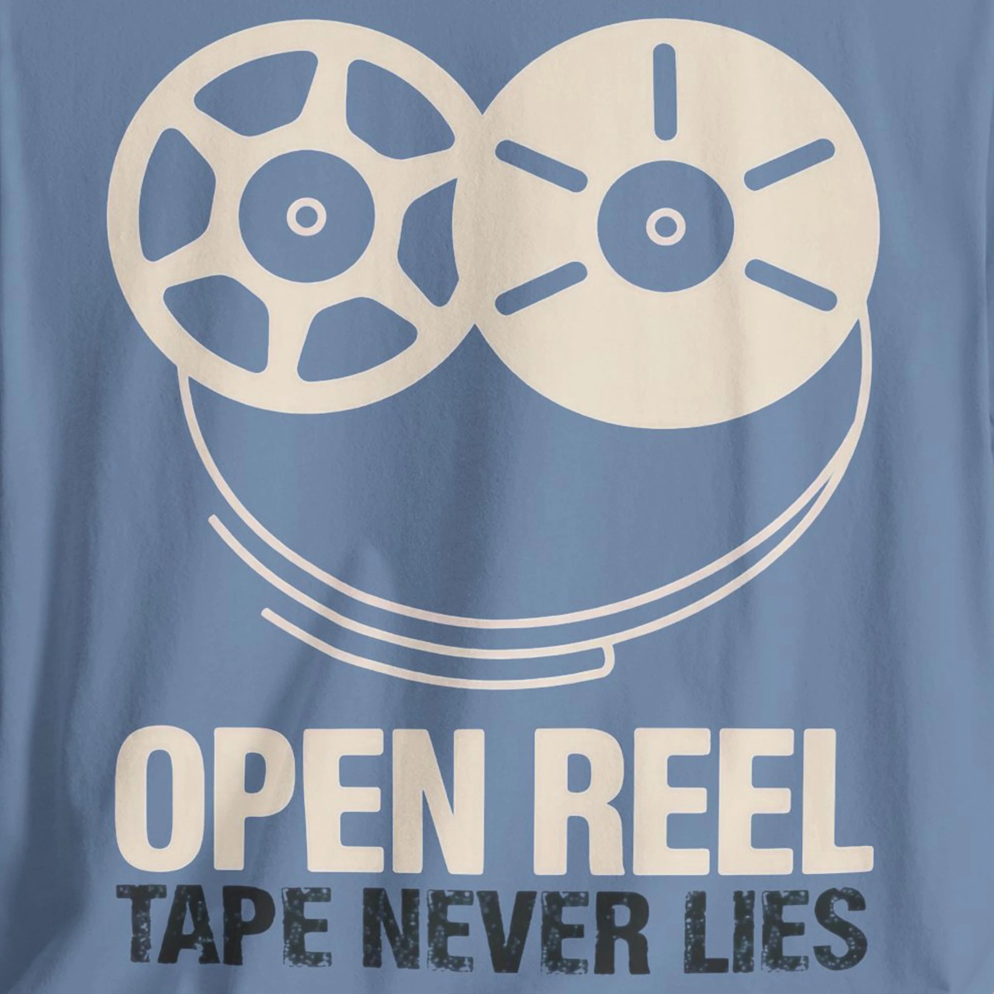 Blue t-shirt with a white reel-to-reel tape design and text 'Open Reel Tape Never Lies' on a blue background.