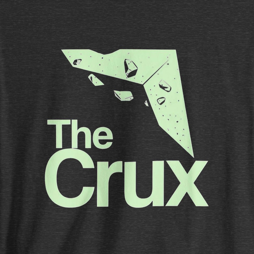 Black t-shirt with 'The Crux' logo in light green on a dark background