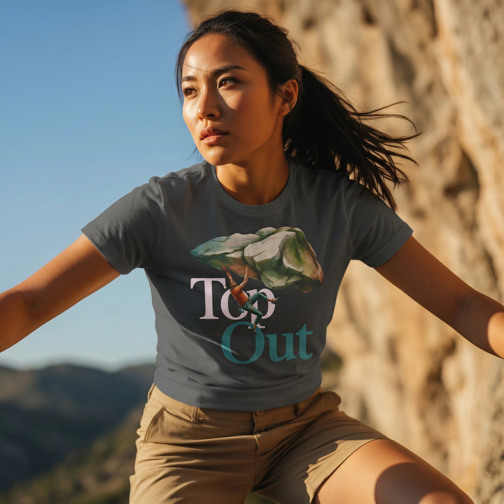 Woman wearing a t-shirt with a nature graphic and text, standing outdoors against a mountainous background.