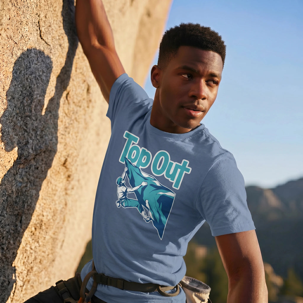 Person wearing a 'Top Out' t-shirt in a mountainous outdoor setting