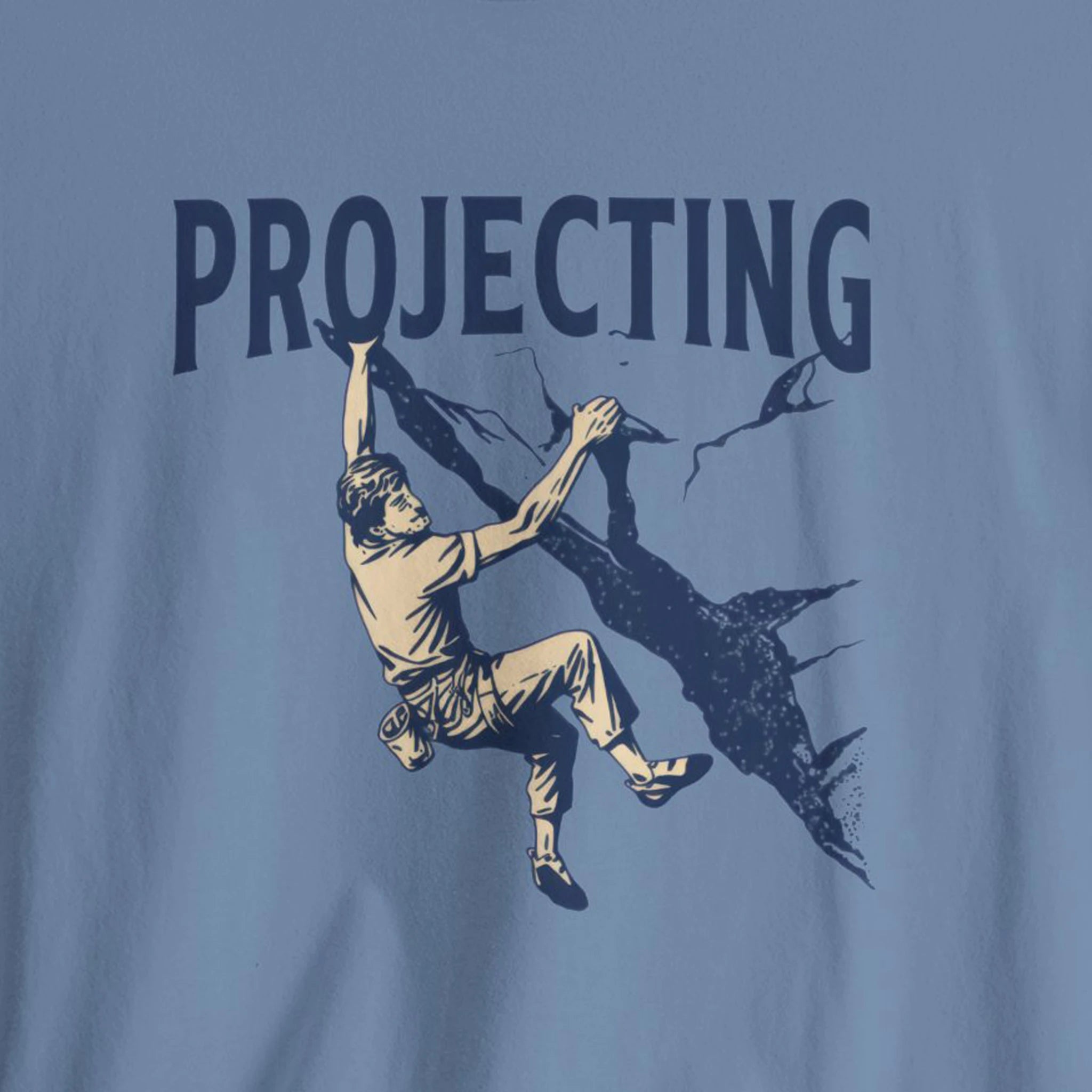 T-shirt with a graphic of a person climbing a rock wall and the word 'PROJECTING' above.