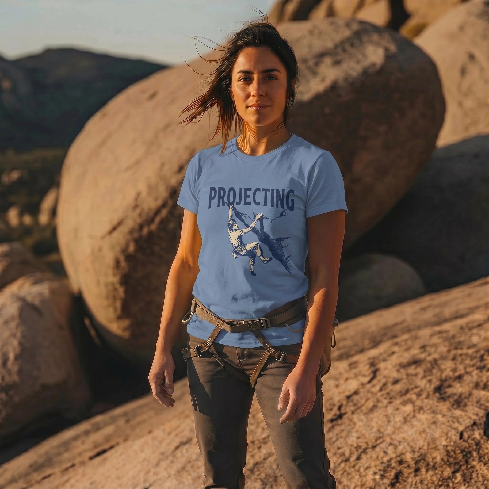 Woman wearing light blue 'Projecting' t-shirt with graphic design outdoors