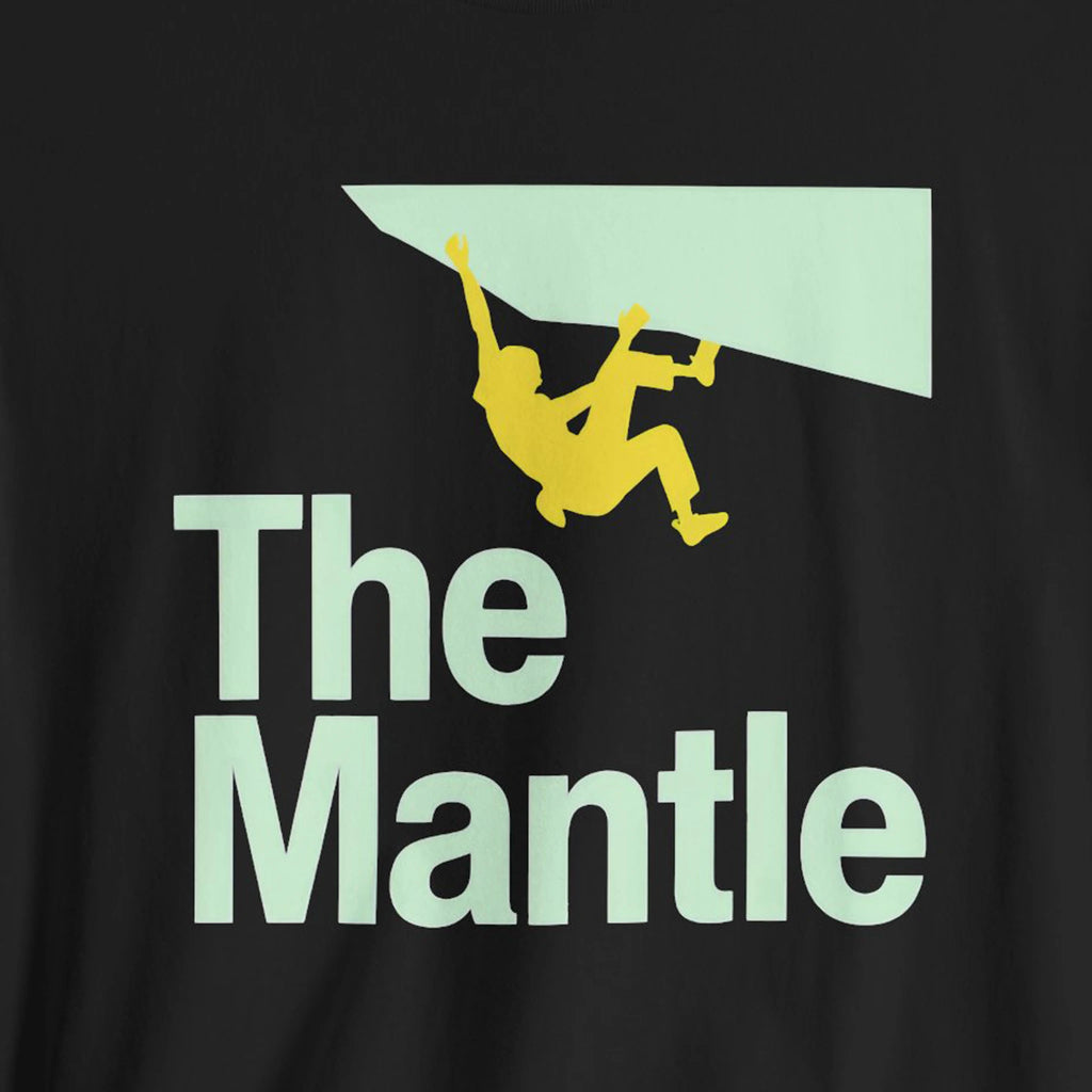 Black t-shirt with 'The Mantle' graphic design featuring a climber on a ledge.