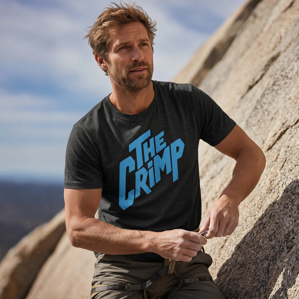Man wearing a black t-shirt with 'The Crimp' in blue on a mountain background