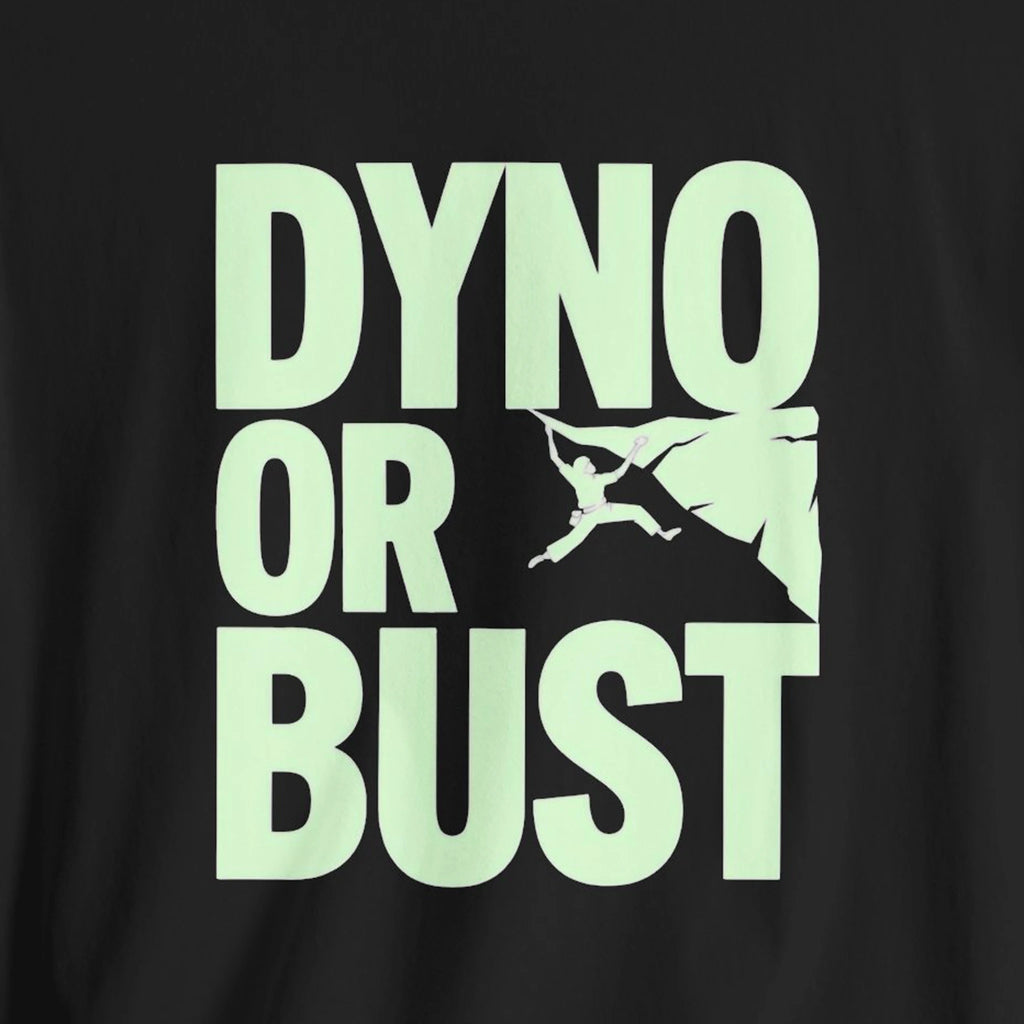 Black t-shirt with 'DYNO OR BUST' text and graphic in light green on a black background