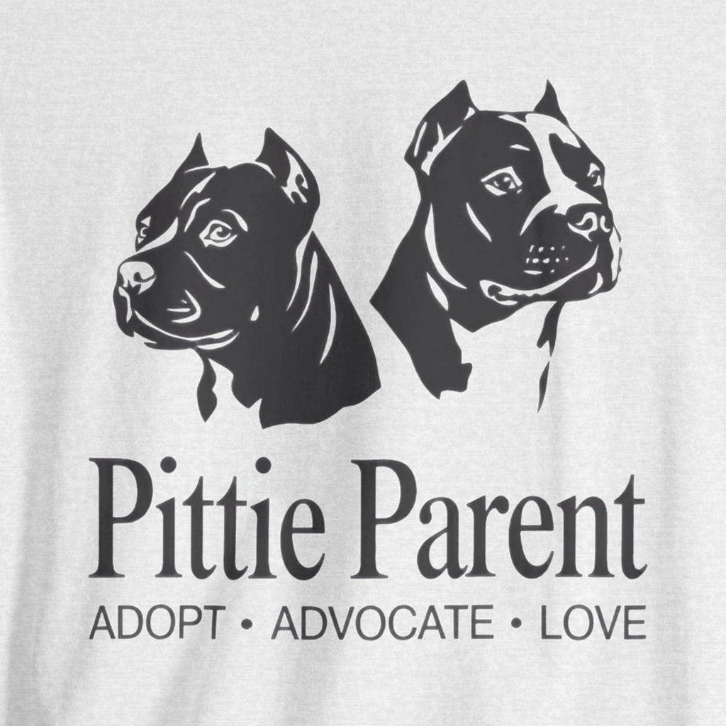 White t-shirt with black dog illustrations and 'Pittie Parent' text on a white background