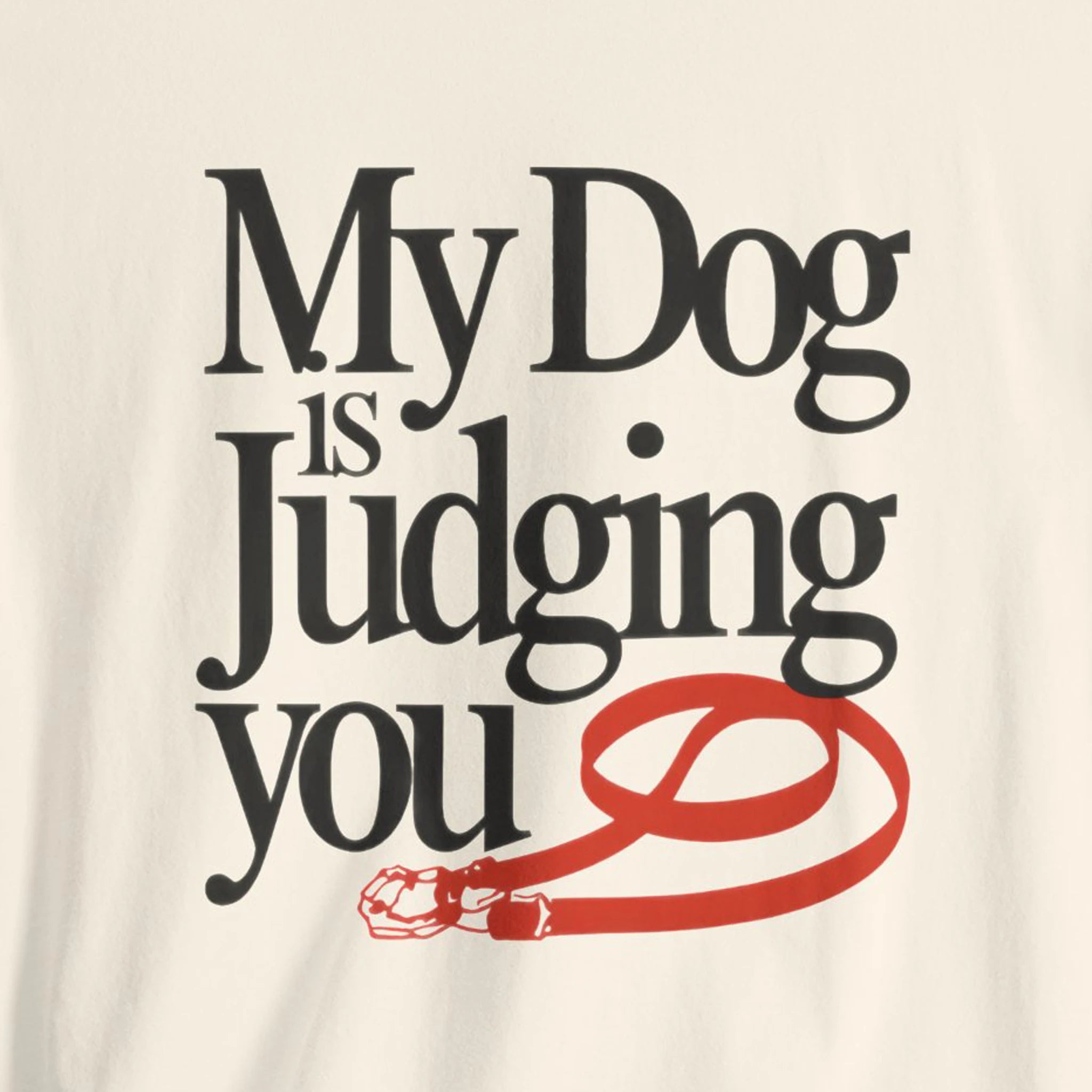 Text shirt with 'My Dog is Judging You' design on a beige background