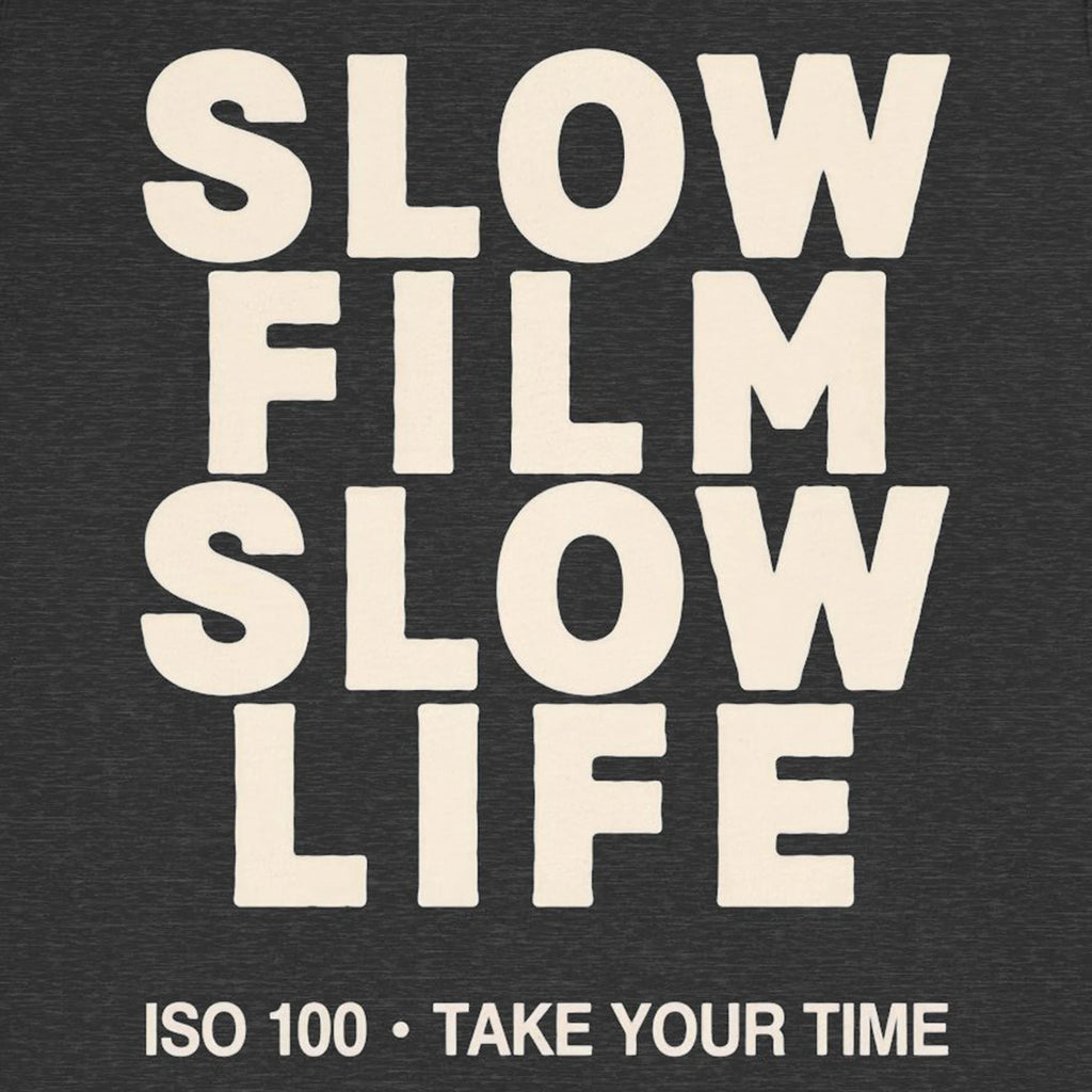 Text 'SLOW FILM SLOW LIFE ISO 100 • TAKE YOUR TIME' on a dark background
