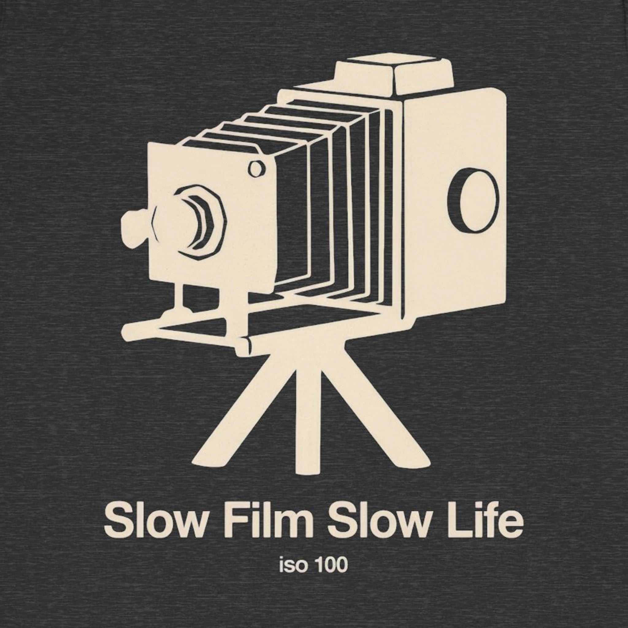 Vintage camera illustration with 'Slow Film Slow Life iso 100' text on a dark background