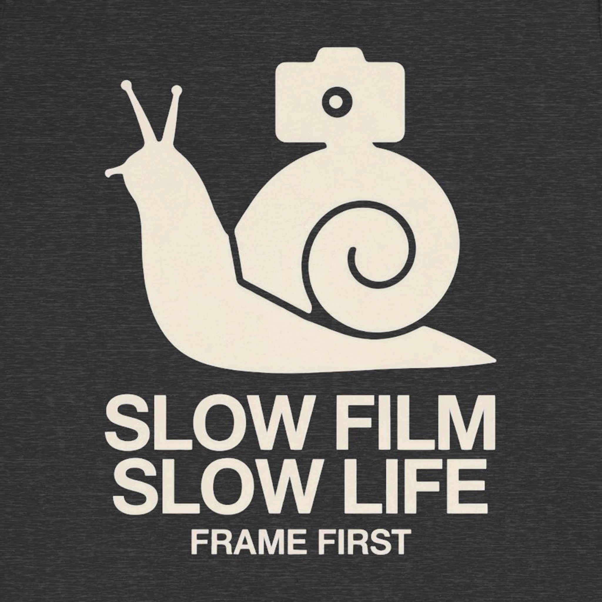 White snail with camera shell and text 'Slow Film Slow Life Frame First' on a black background