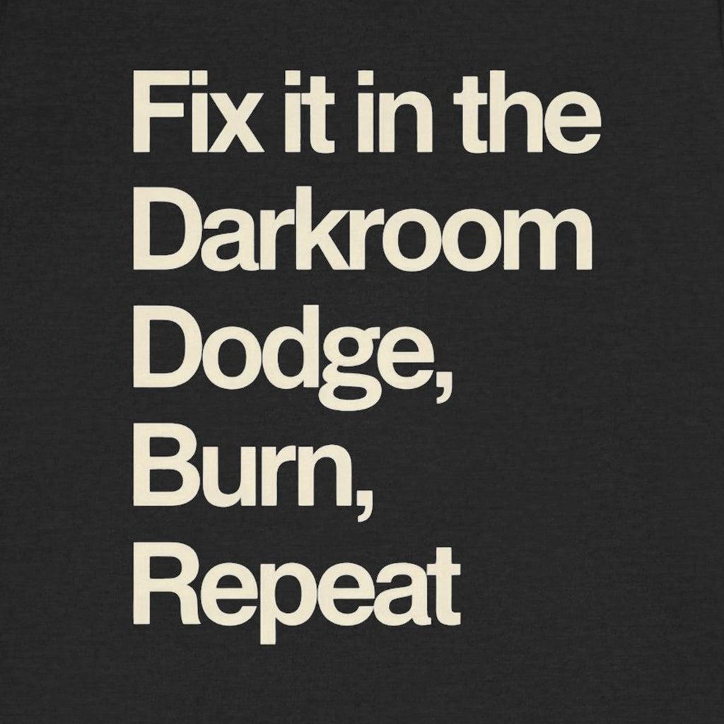 Text 'Fix it in the Darkroom Dodge, Burn, Repeat' on a black background