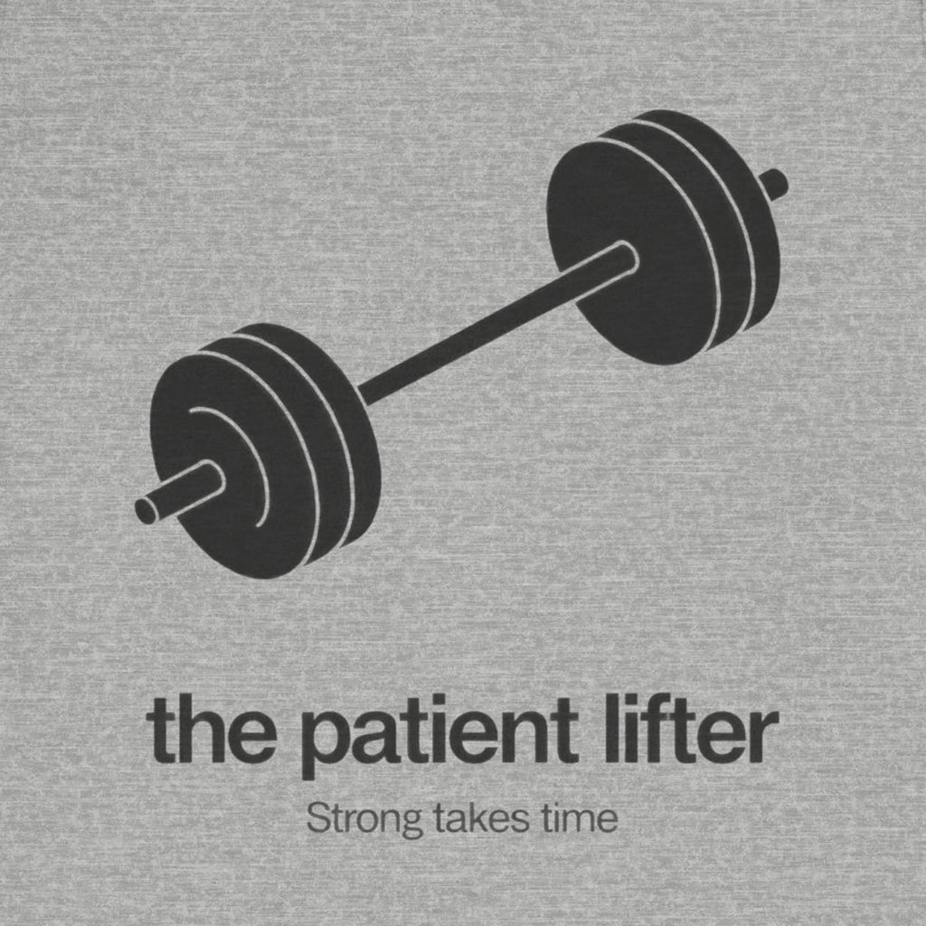 Gray t-shirt with a barbell graphic and text 'the patient lifter Strong takes time' on a gray background