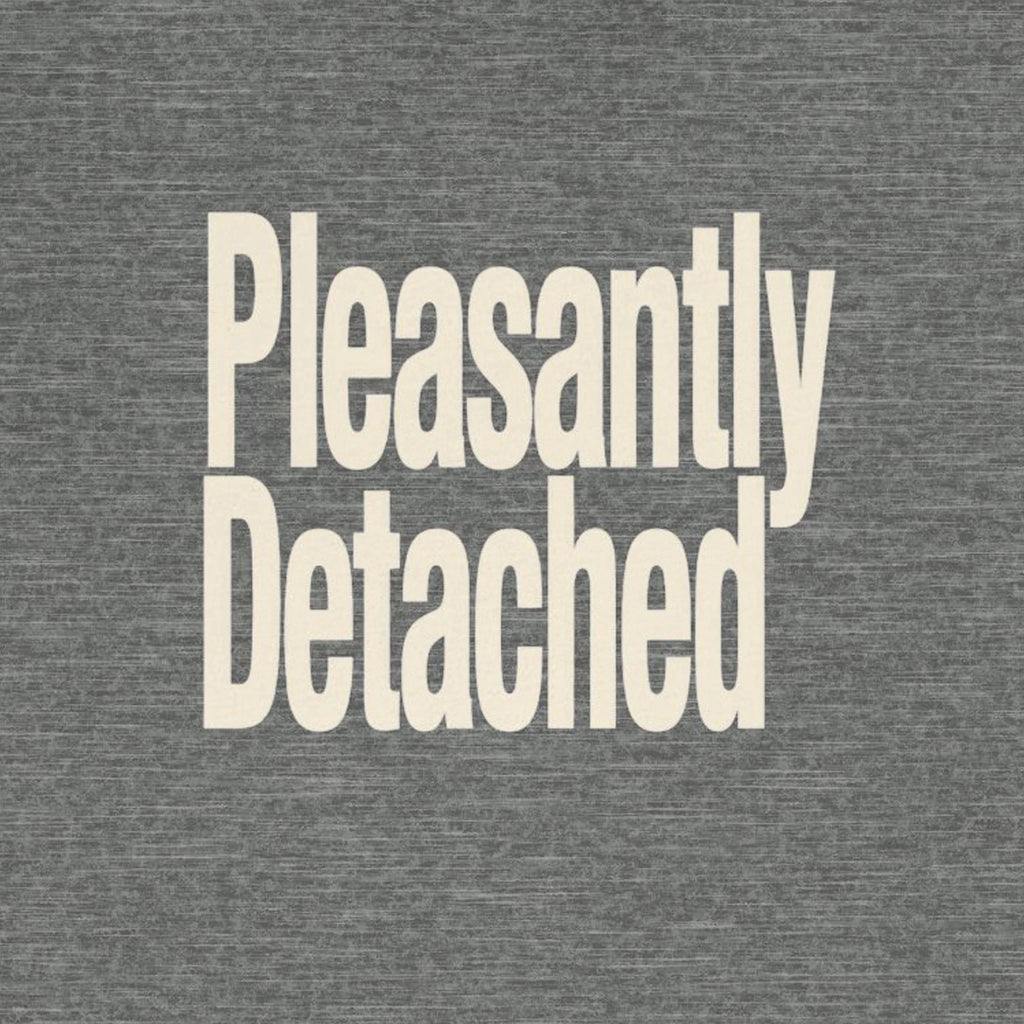 Text 'Pleasantly Detached' on a gray background