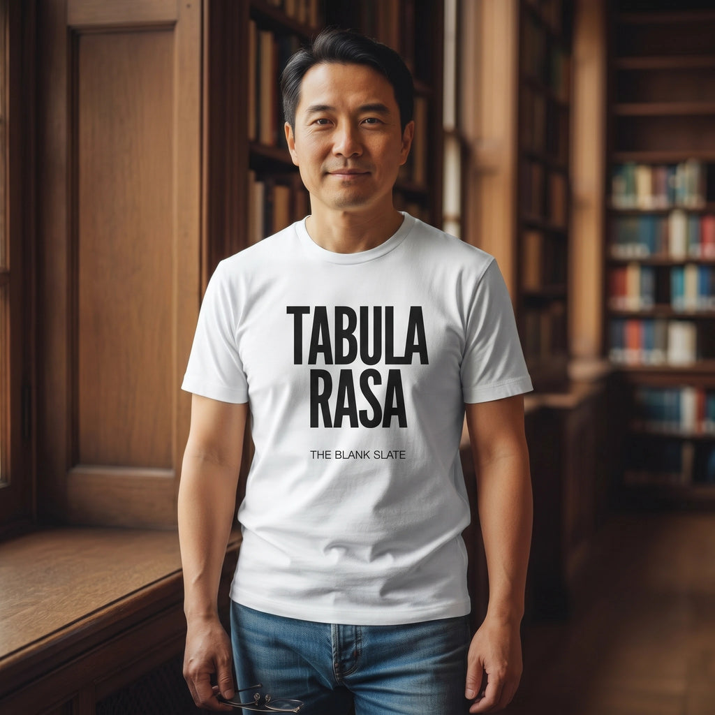 Man wearing a white t-shirt with 'TABULA RASA' text in a library setting