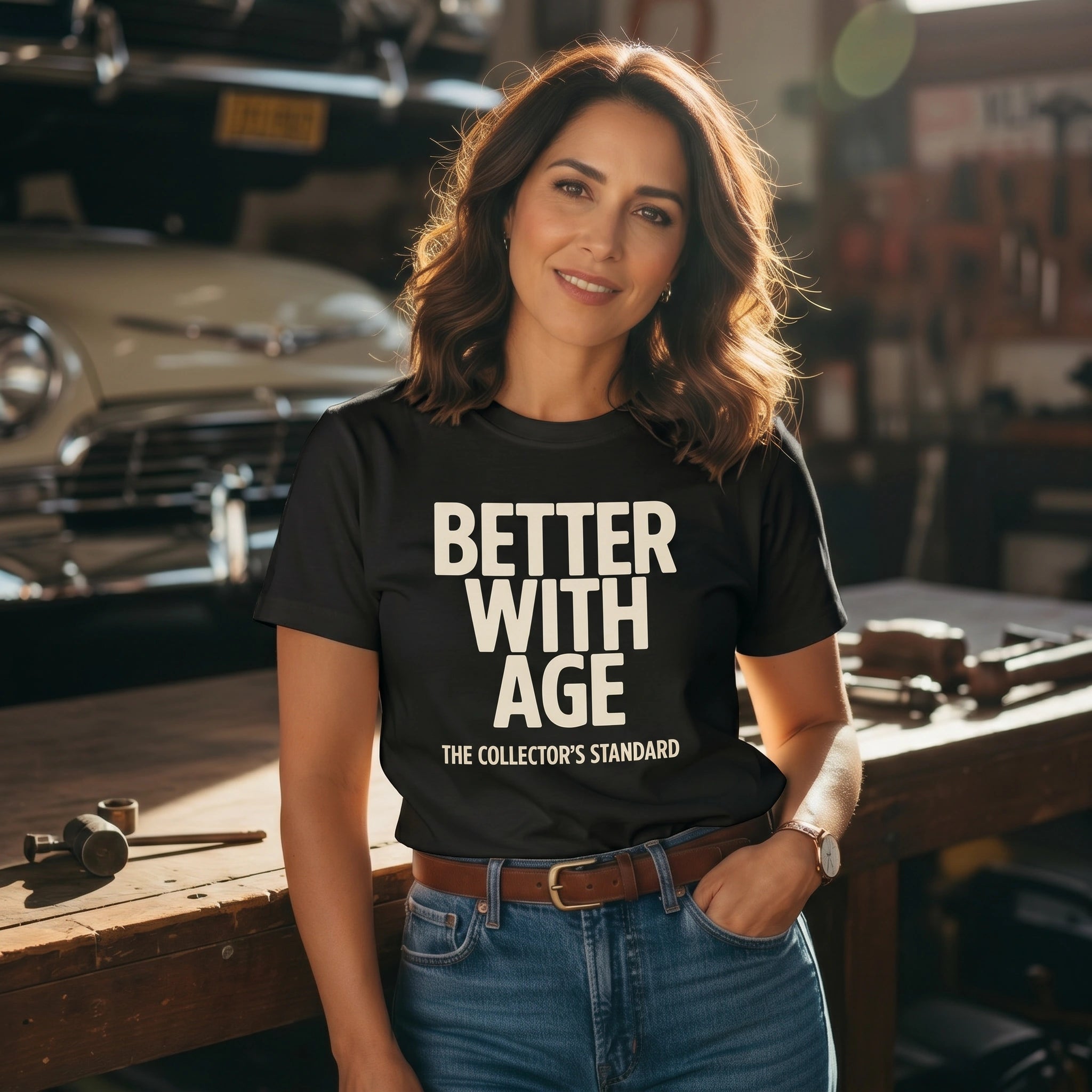 Woman wearing a black t-shirt with 'Better with Age' text in a workshop setting