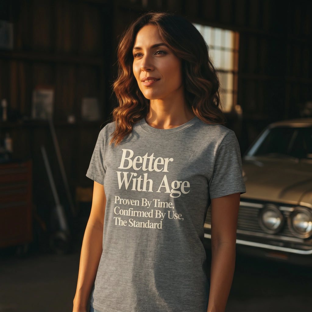 Woman wearing a gray t-shirt with 'Better With Age' text in a garage setting