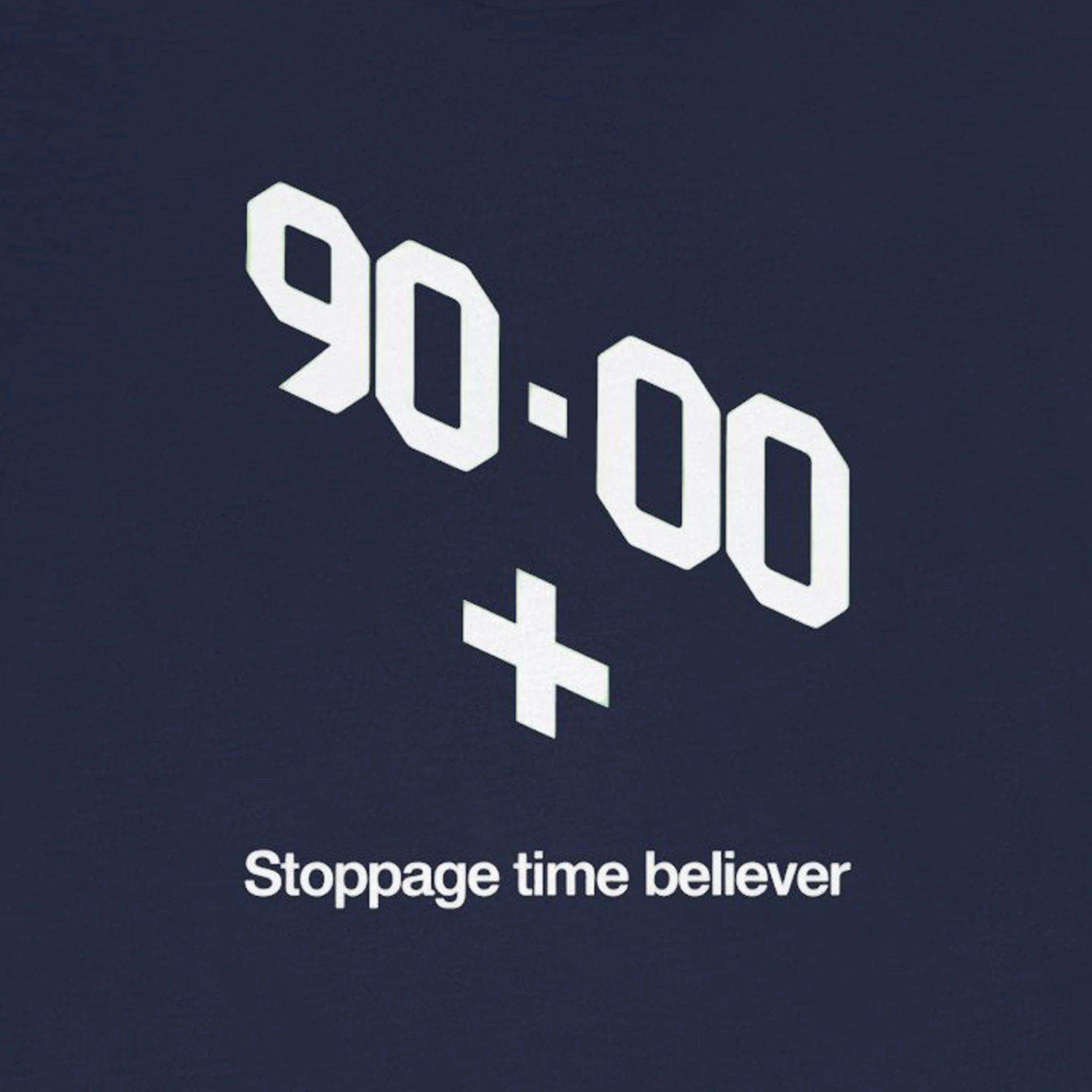 Navy blue shirt with white text '90-00 + Stoppage time believer' on a solid background