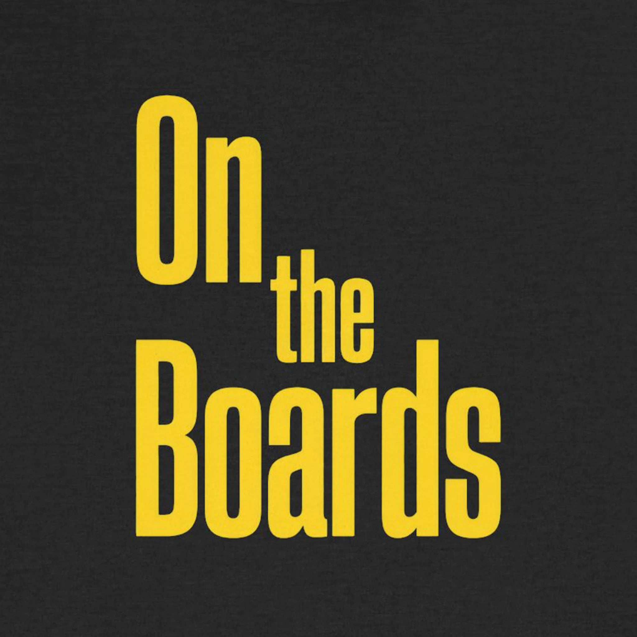 Text 'On the Boards' in yellow on a black background
