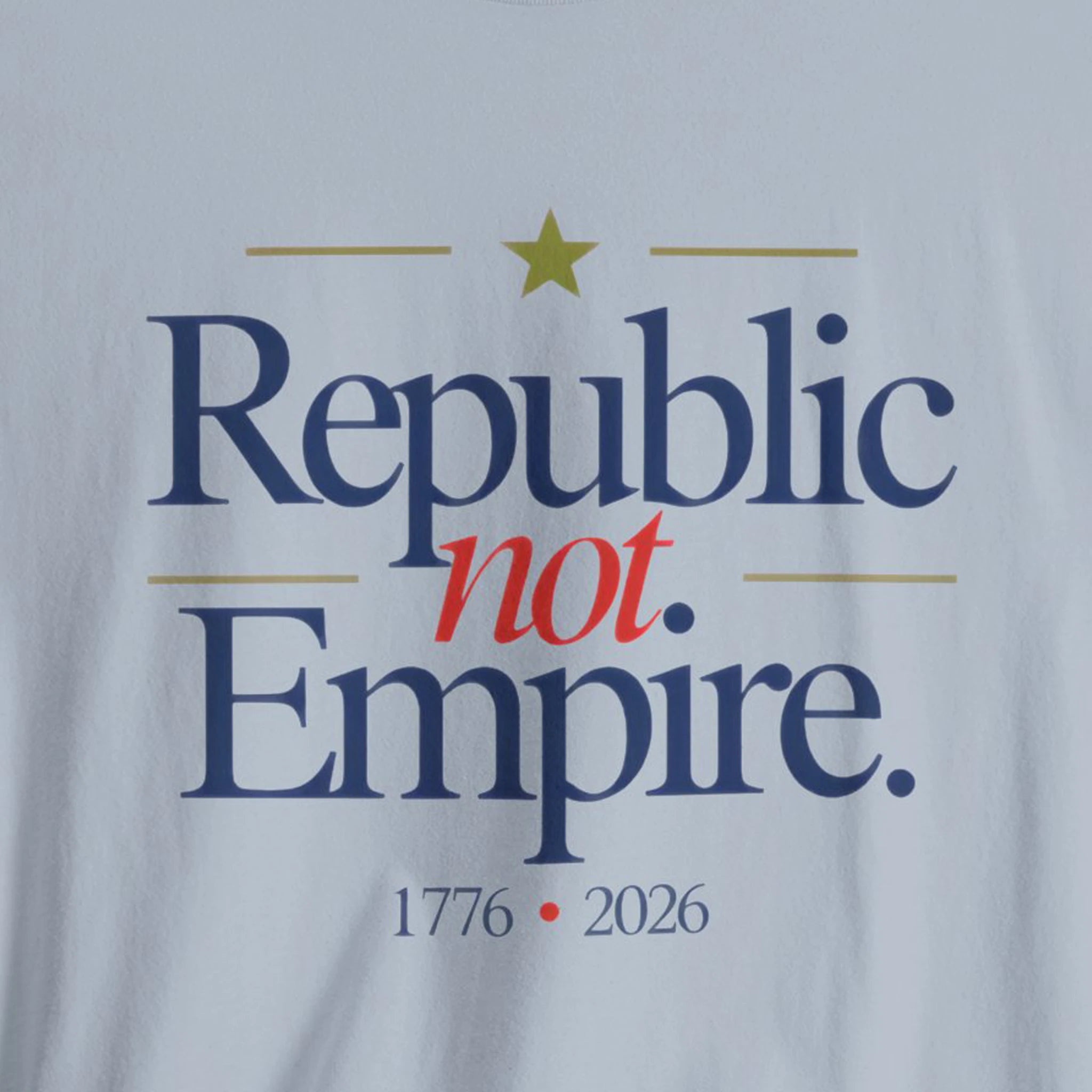 T-shirt with 'Republic not Empire' text and a star on a light blue background