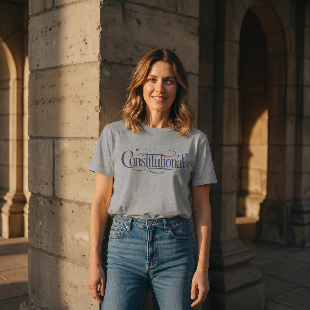 Woman wearing a 'Constitutional' t-shirt standing in front of stone arches.