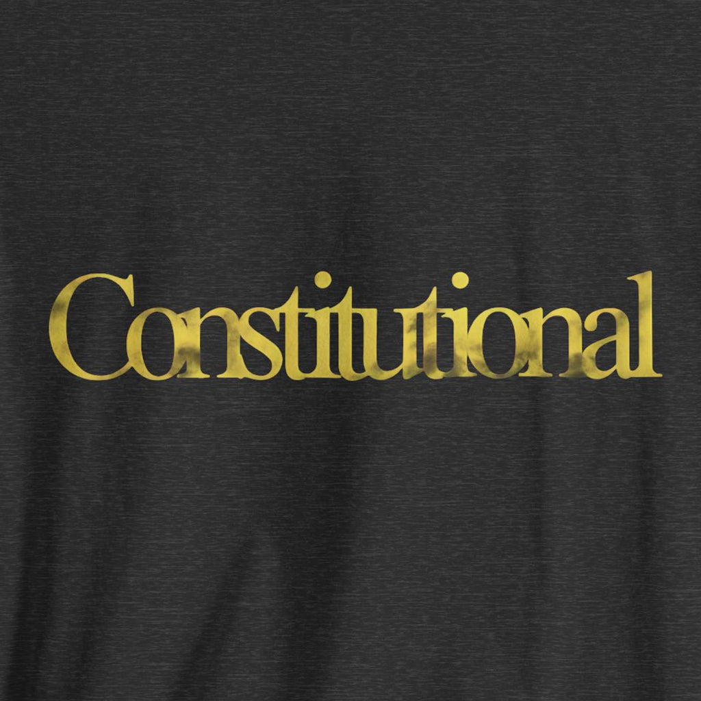 Black t-shirt with 'Constitutional' printed in gold on a plain background