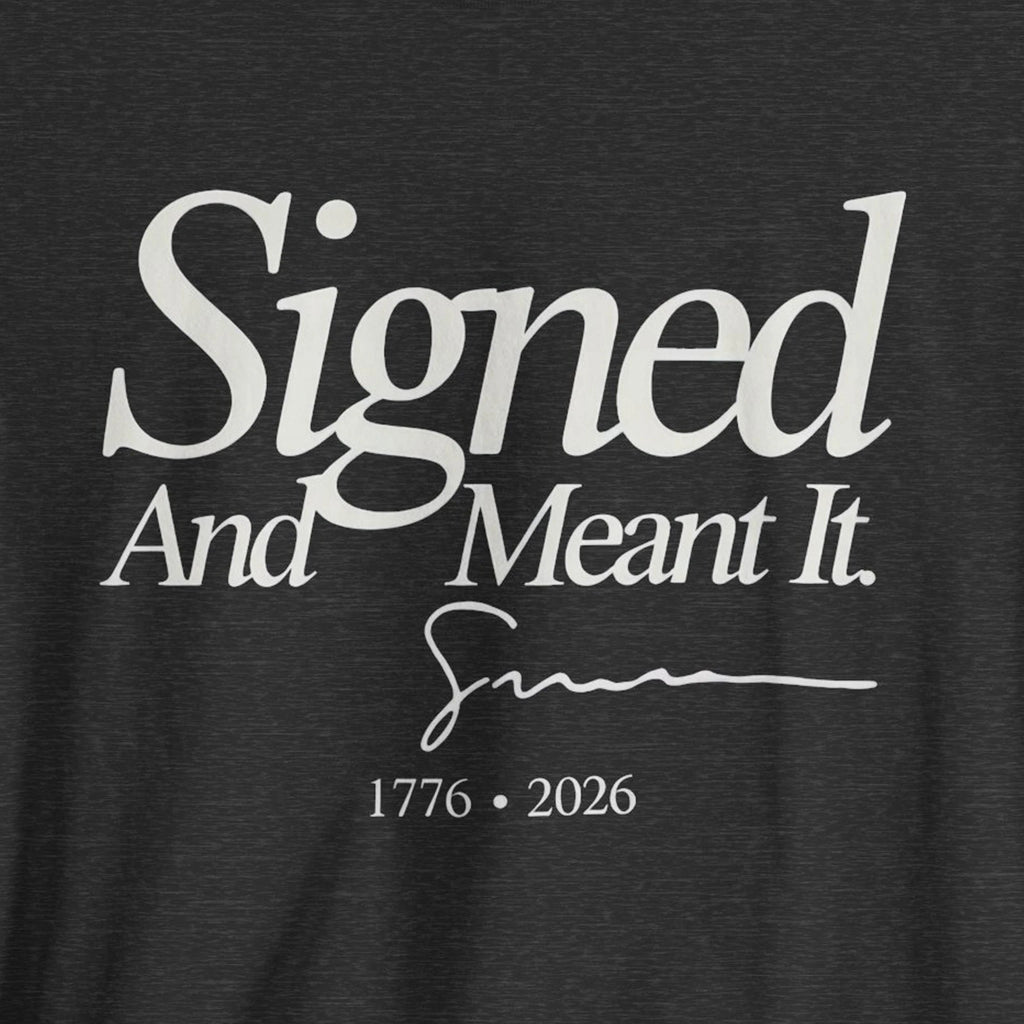 Black t-shirt with white text 'Signed And Meant It. 1776 - 2026' 