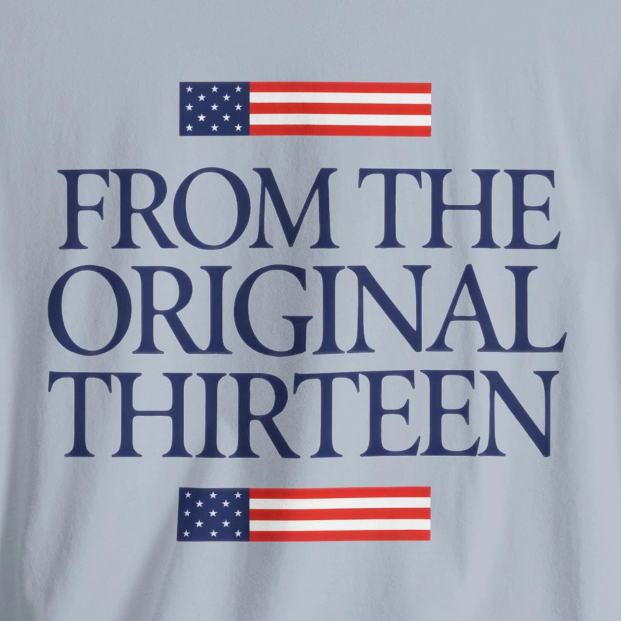 Light blue t-shirt with 'From the Original Thirteen' text and American flags 